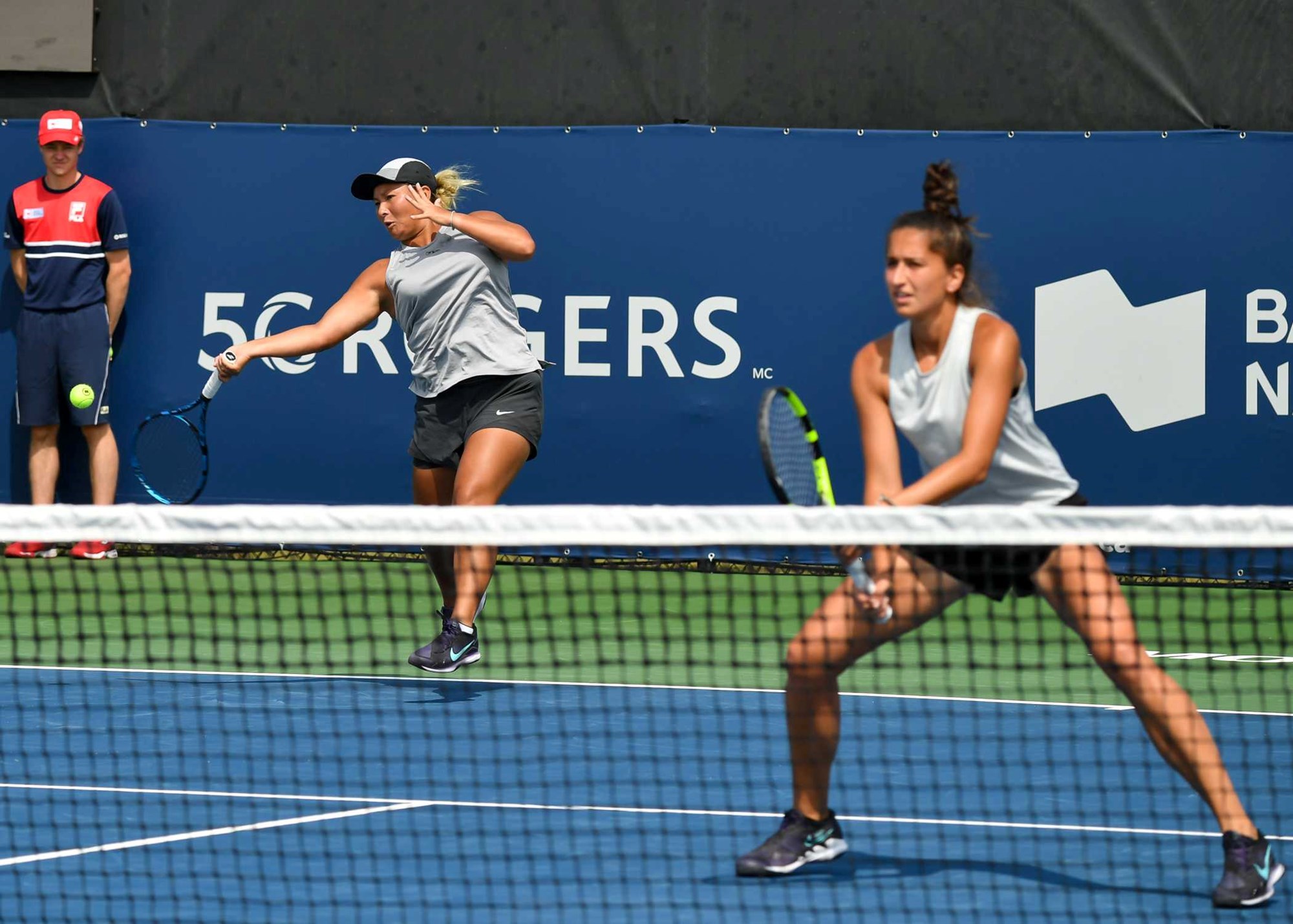 Tara Moore hitting a forehand in the Monterrey Open women's doubles with Emina Bektas