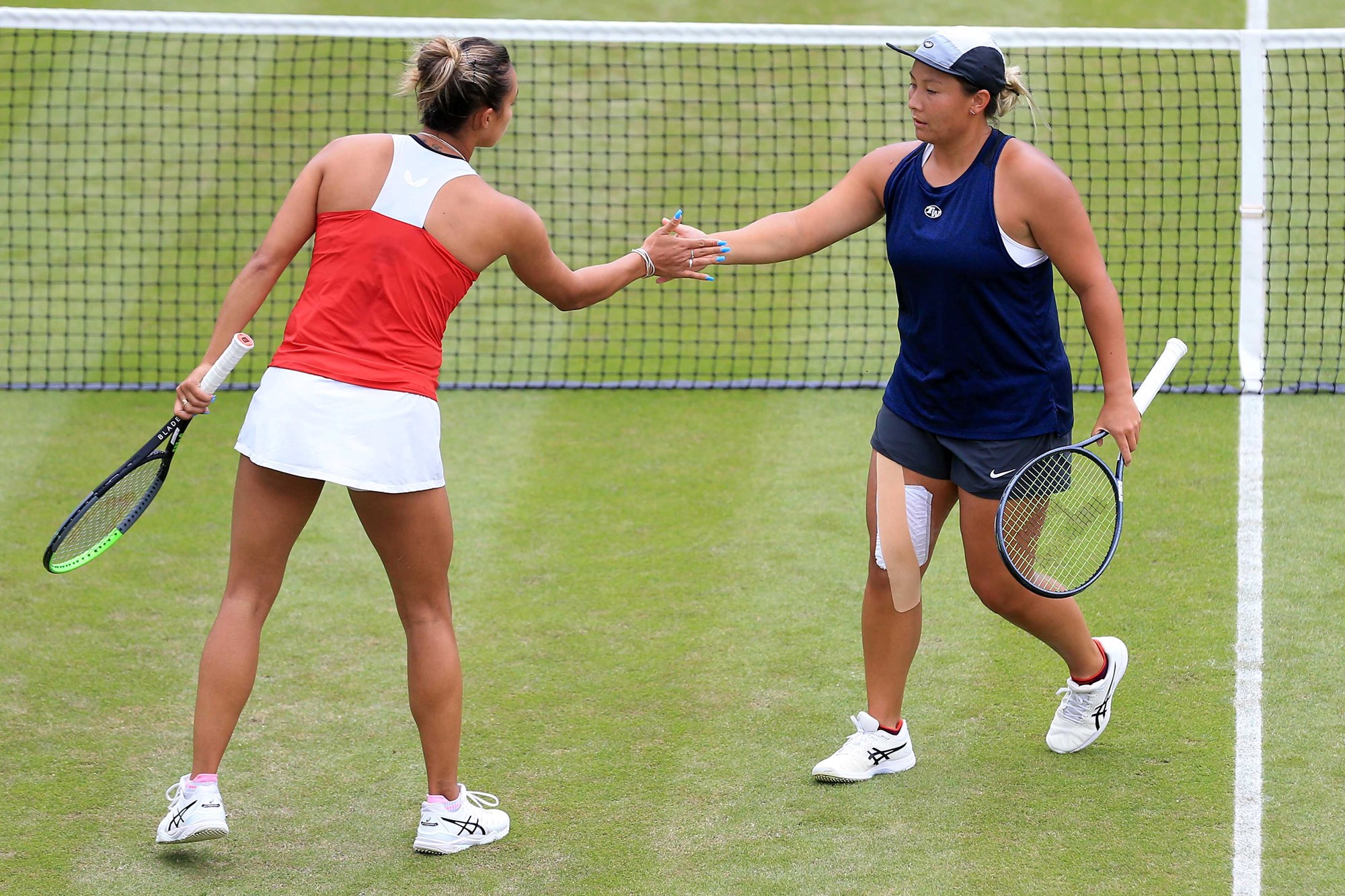 Tara Moore and Eden Silva high-fiving at the Birmingham Classic in 2021