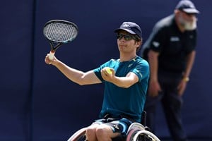 Greg Slade serving at the Bolton Indoor ITF 2 Wheelchair Tennis Tournament