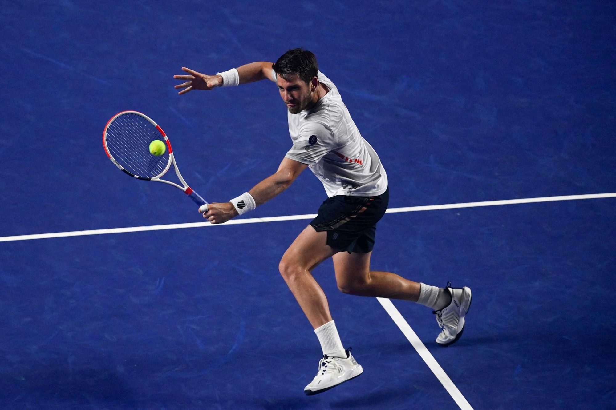 Cam Norrie hitting a volley against Rafael Nadal in Acapulco