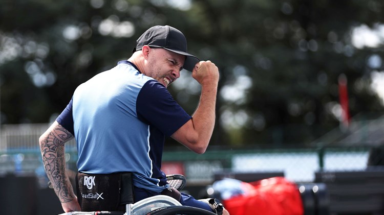 Andy Lapthorne clenching his fist in celebration on court at the 2024 Australian Open