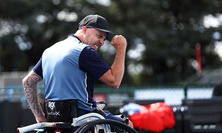 Andy Lapthorne clenching his fist in celebration on court at the 2024 Australian Open