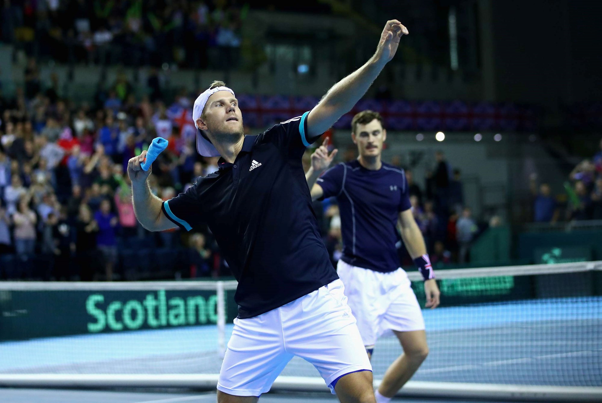 Dom Inglot celebrates a Davis Cup win in Glasgow by throwing his wristband into the crowd