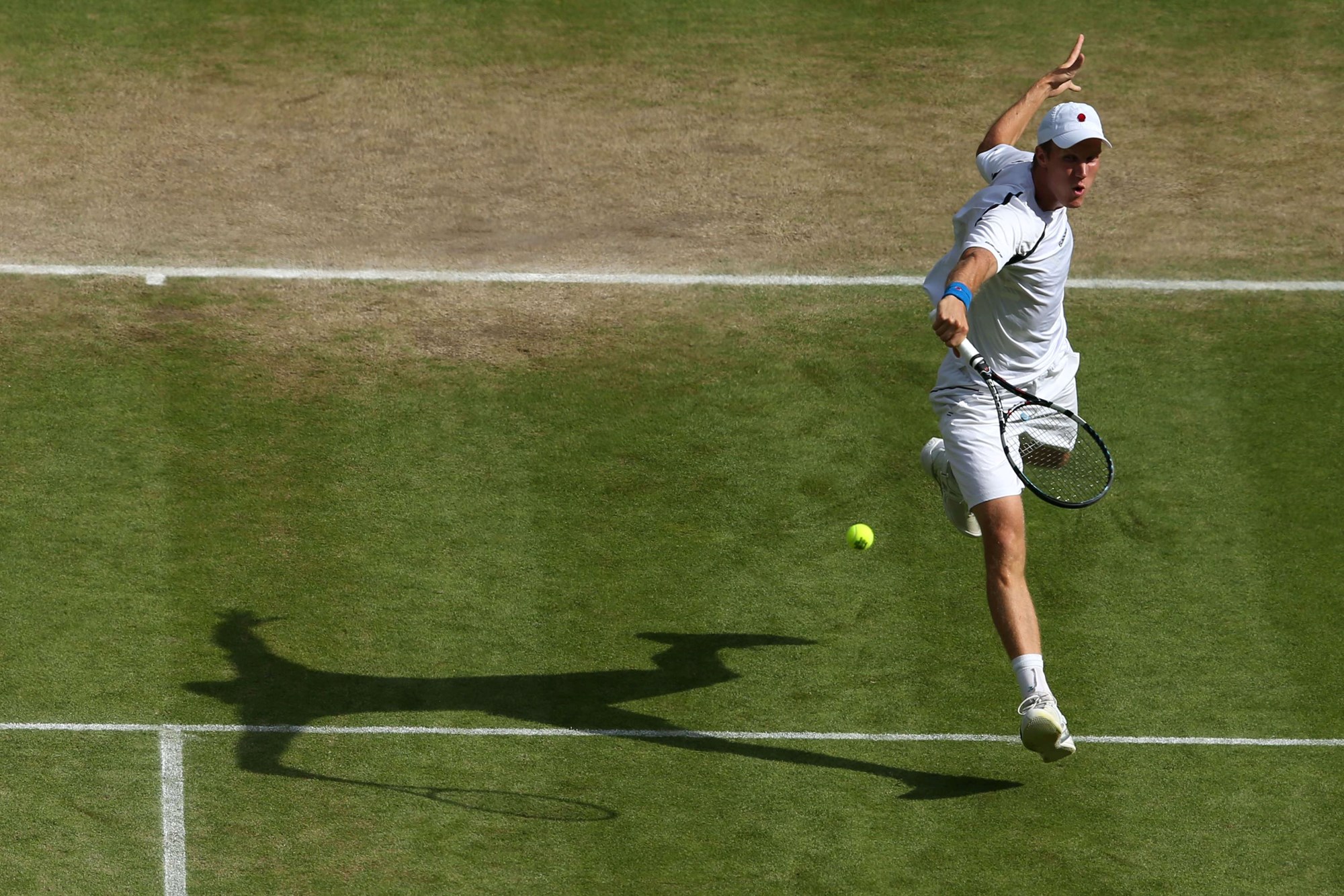 Dom Inglot hitting a volley at Wimbledon in 2012