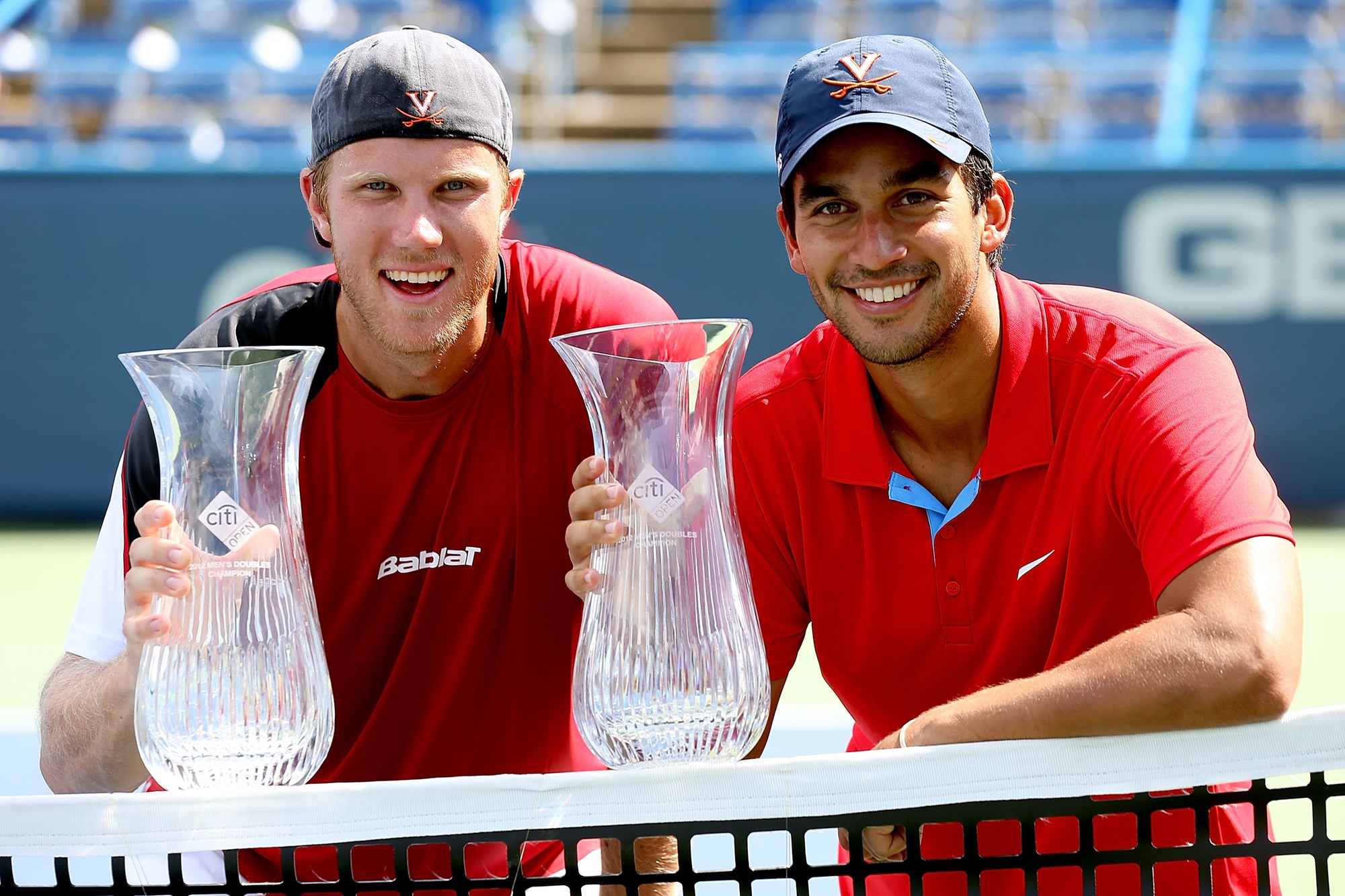 Dom Inglot and Treat Huey with the ATP Washington trophy  in 2012
