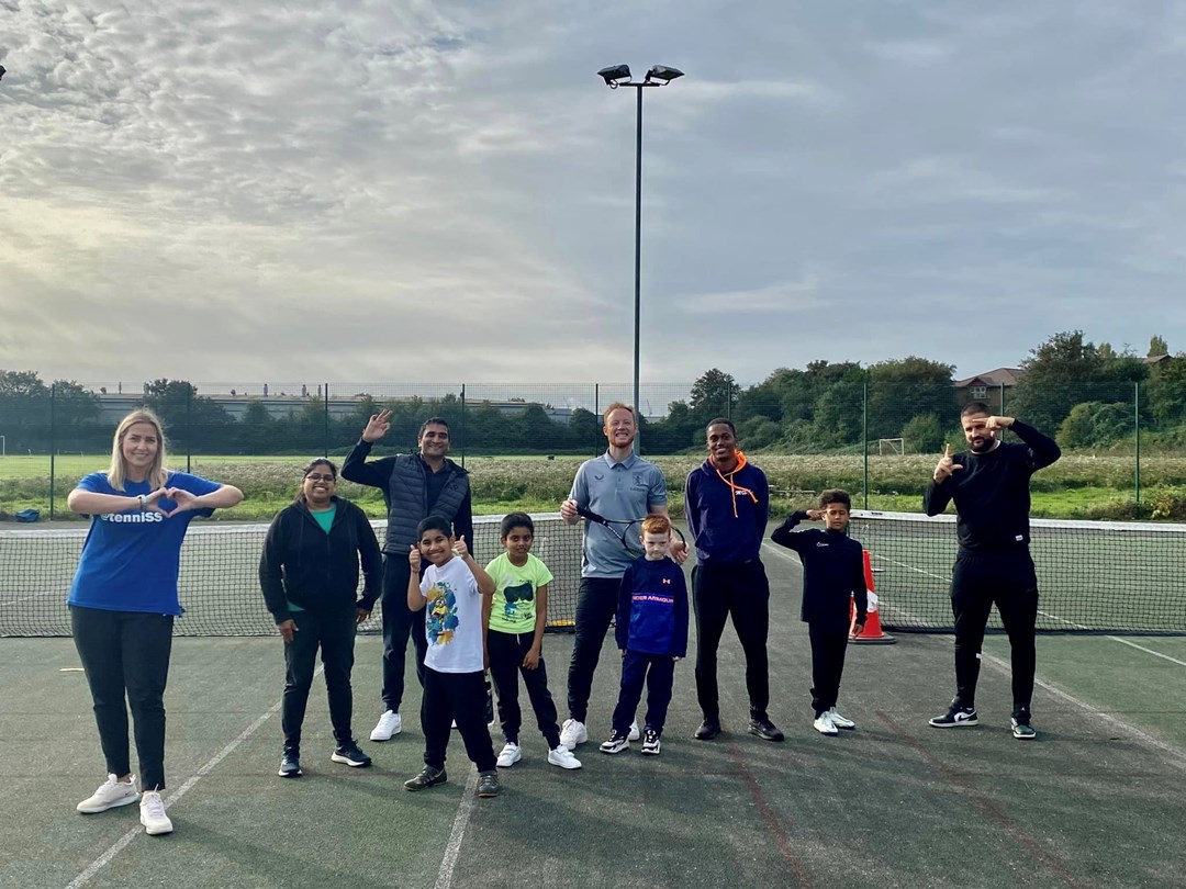 Thabo and fellow Tennis Activators pictured smiling and posing during the delivery of a tennis session as part of Everyone 4 Sport’s Inner-city tennis programme at Holford Drive Community Tennis Club.