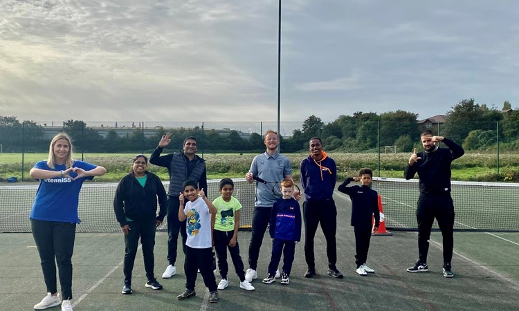 Thabo and fellow Tennis Activators pictured smiling and posing during the delivery of a tennis session as part of Everyone 4 Sport’s Inner-city tennis programme at Holford Drive Community Tennis Club. 