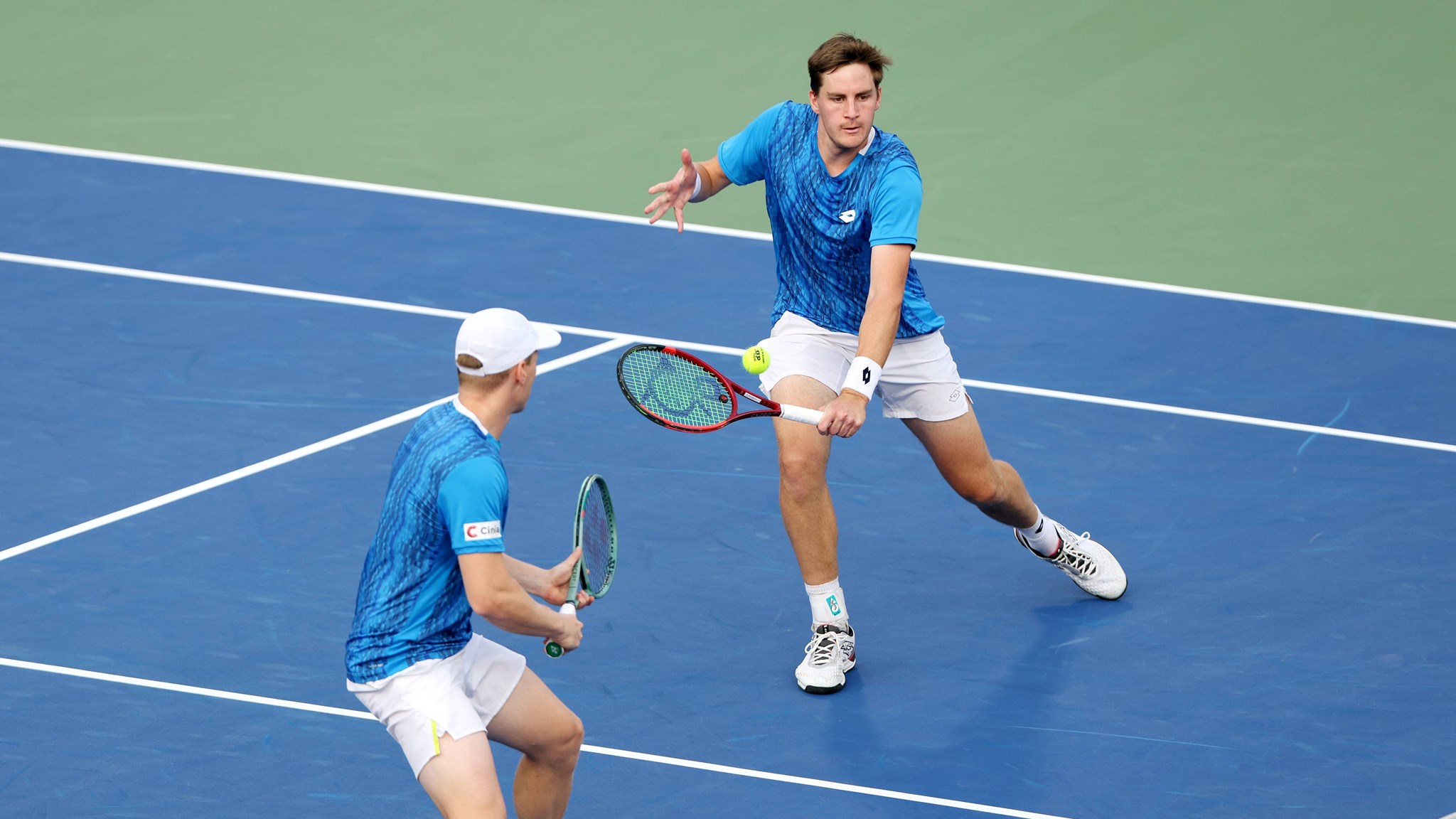 Henry Patten stretching for a volley at the Dubai Duty Free Tennis Championships