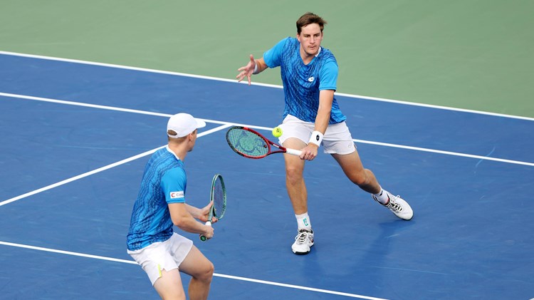 Henry Patten stretching for a volley at the Dubai Duty Free Tennis Championships