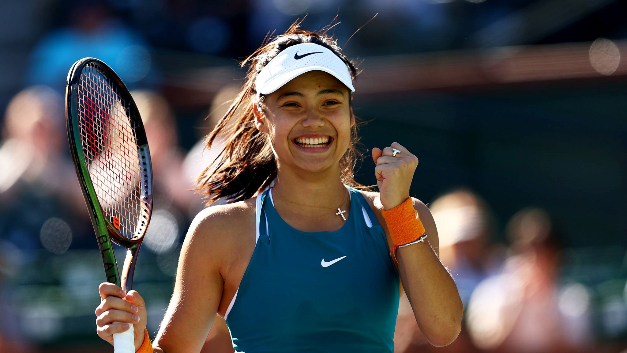 Emma Raducanu celebrating winning a tough battle against Caroline Garcia at Indian Wells 2022