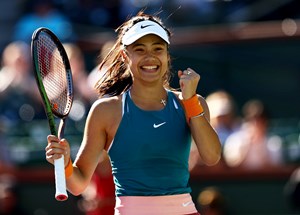 Emma Raducanu celebrating winning a tough battle against Caroline Garcia at Indian Wells 2022