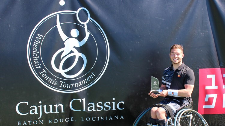 Alfie Hewett holding the 2022 Cajun Classic singles trophy