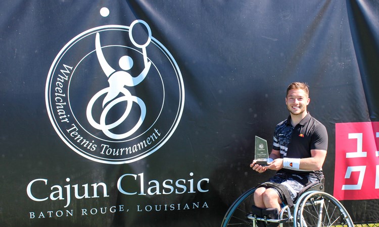 Alfie Hewett holding the 2022 Cajun Classic singles trophy