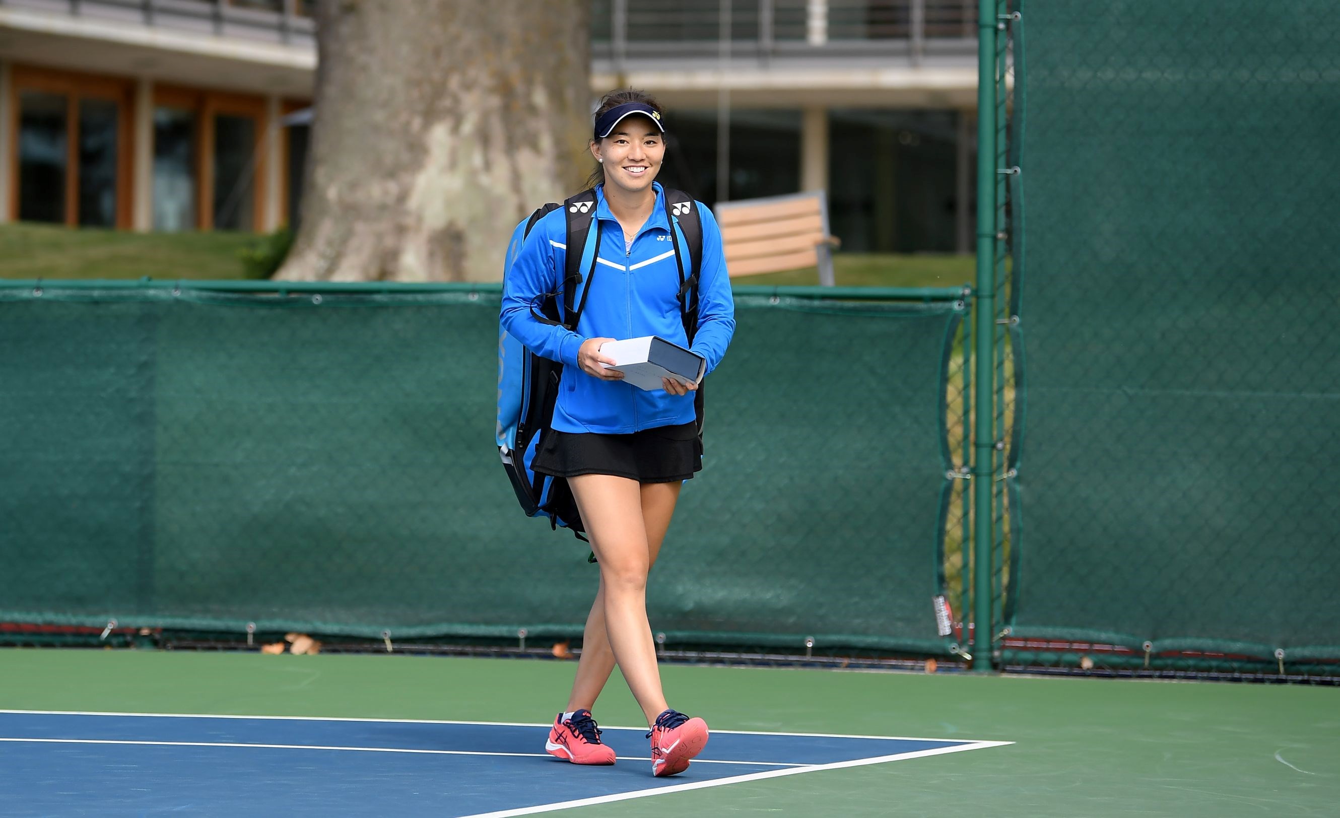 Lily Miyazaki walking on court at the British Tour tournament at the National Tennis Centre