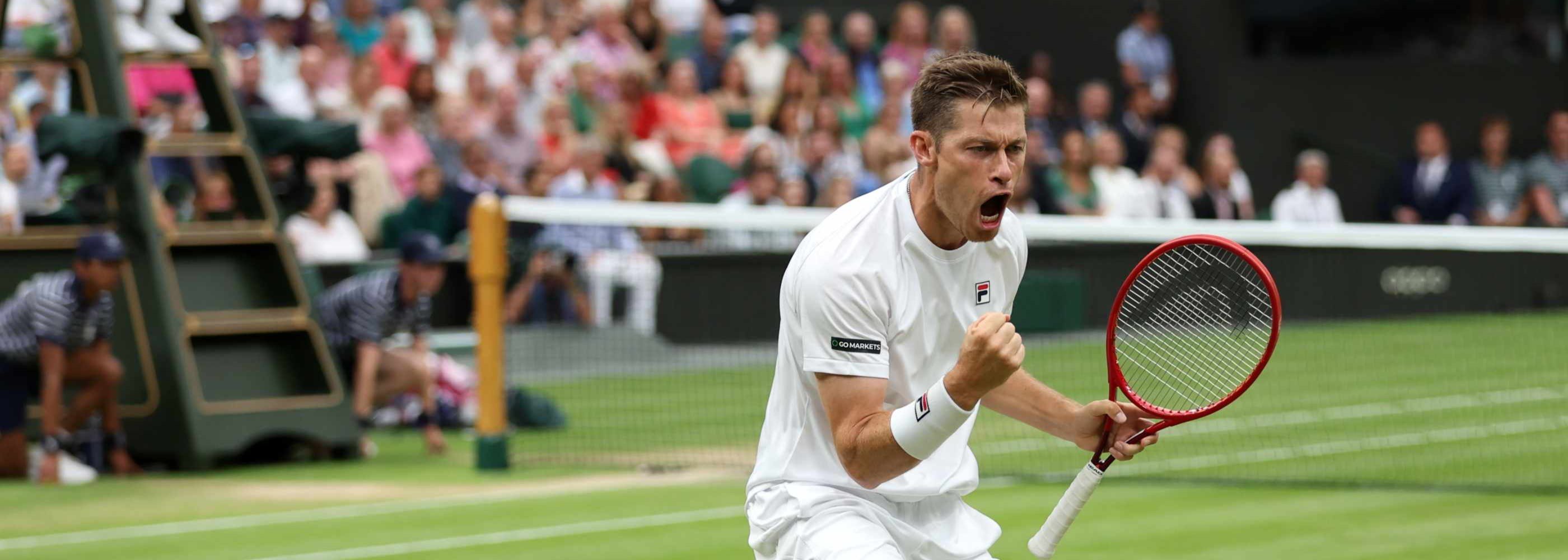 Neal Skupski clenching his fist in celebration during the 2023 Wimbledon men's doubles final