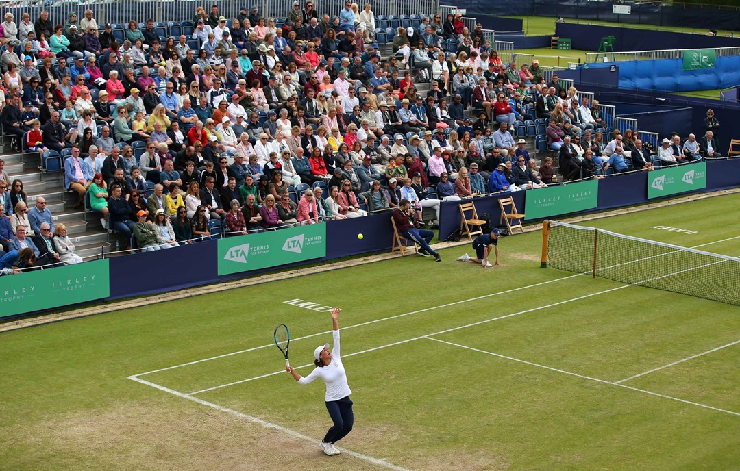 Player serving at the Ilkley Trophy in 2019