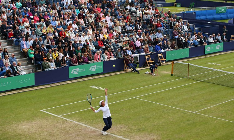 Player serving at the Ilkley Trophy in 2019