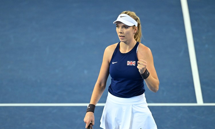 Katie Boulter stood on court at the Billie Jean King Cup wearing a navy top with a British flag on it