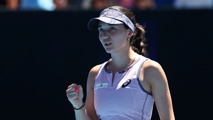German tennis player Eva Lys clinches her fist in celebration while on court at the Australian Open