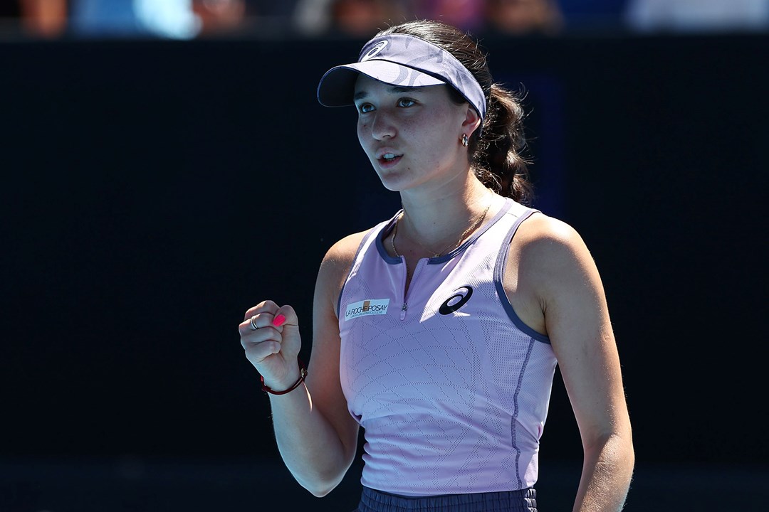 German tennis player Eva Lys clinches her fist in celebration while on court at the Australian Open