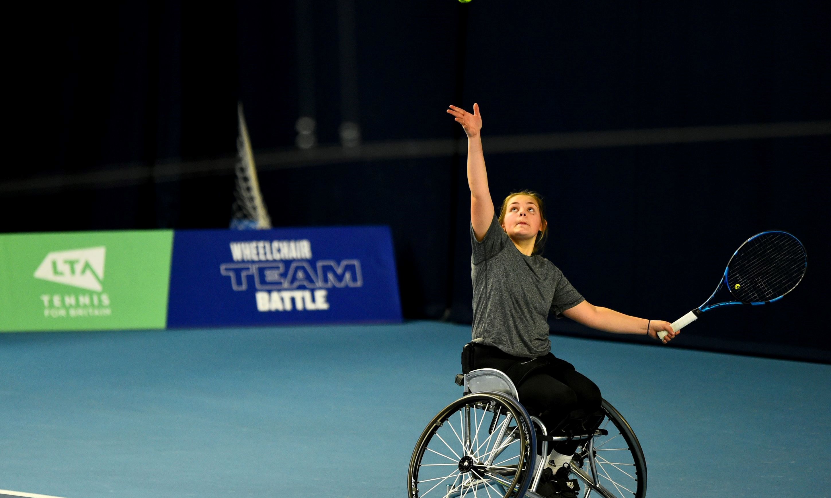 Ruby Bishop preparing to serve at the LTA Wheelchair Team Battle