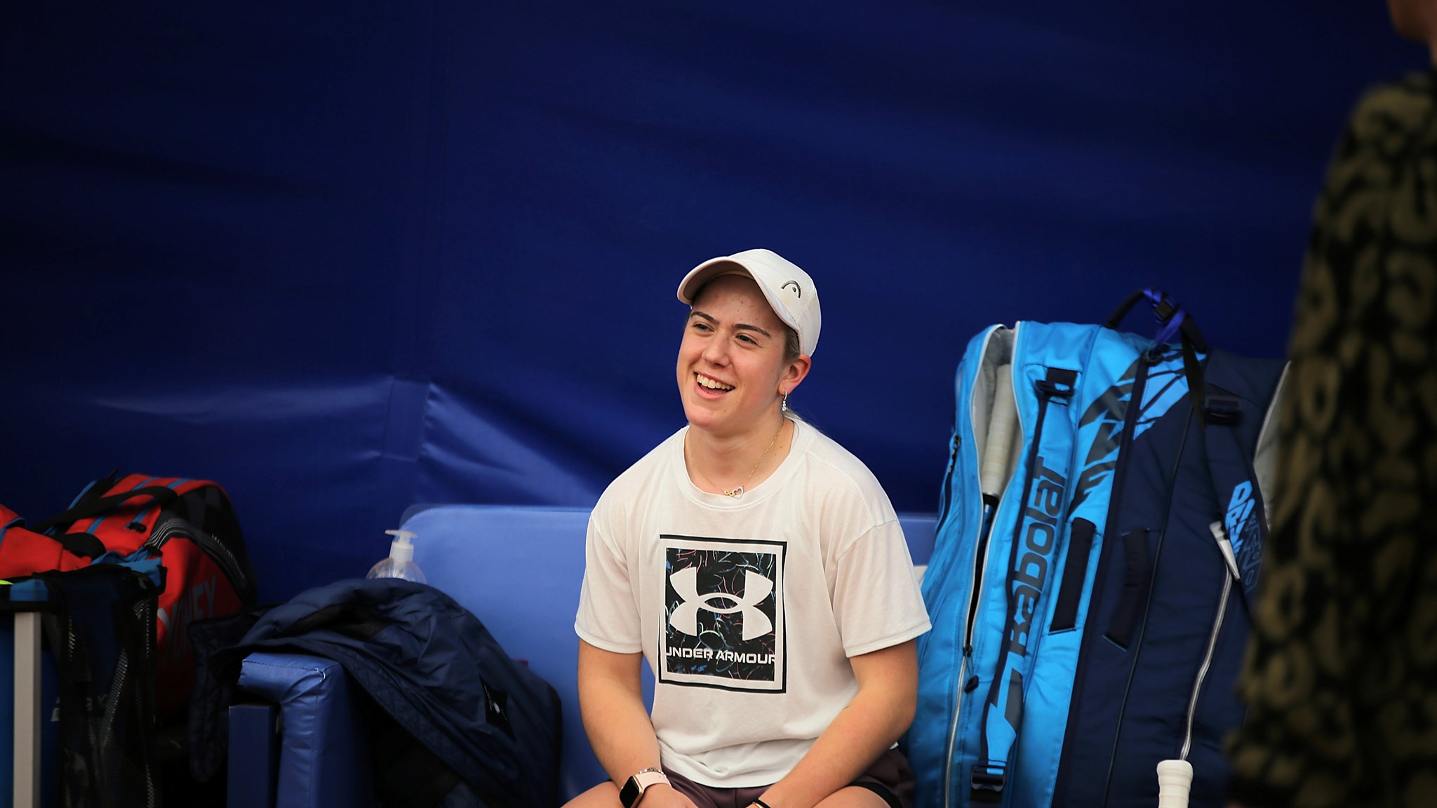 Sonay Kartal perching on a chair at the NTCduring her training for the Billie Jean King Cup 2022