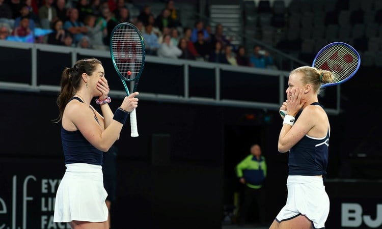 Jodie Burrage and Harriet Dart smile in celebration after beating Australia at Billie Jean King Cup