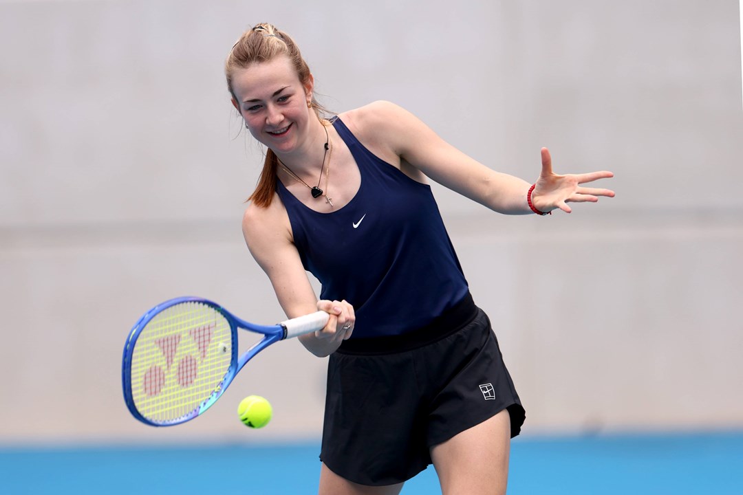 Mika Stojsavljevic smiles as she hits a forehand in practice at the Billie Jean King Cup