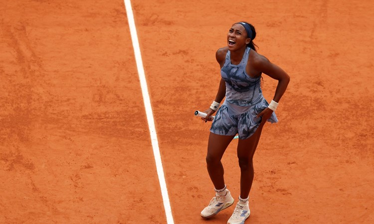 Coco Gauff roars in celebration after winning the Roland Garros title