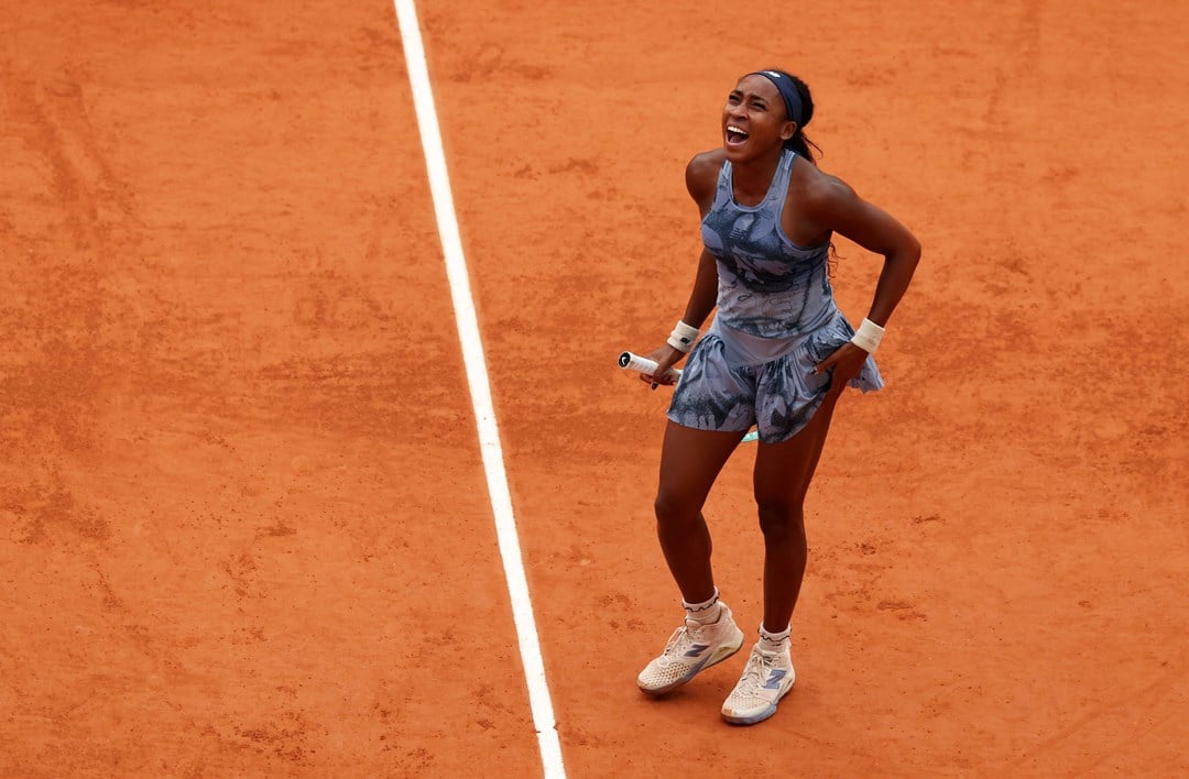 Coco Gauff roars in celebration after winning the Roland Garros title
