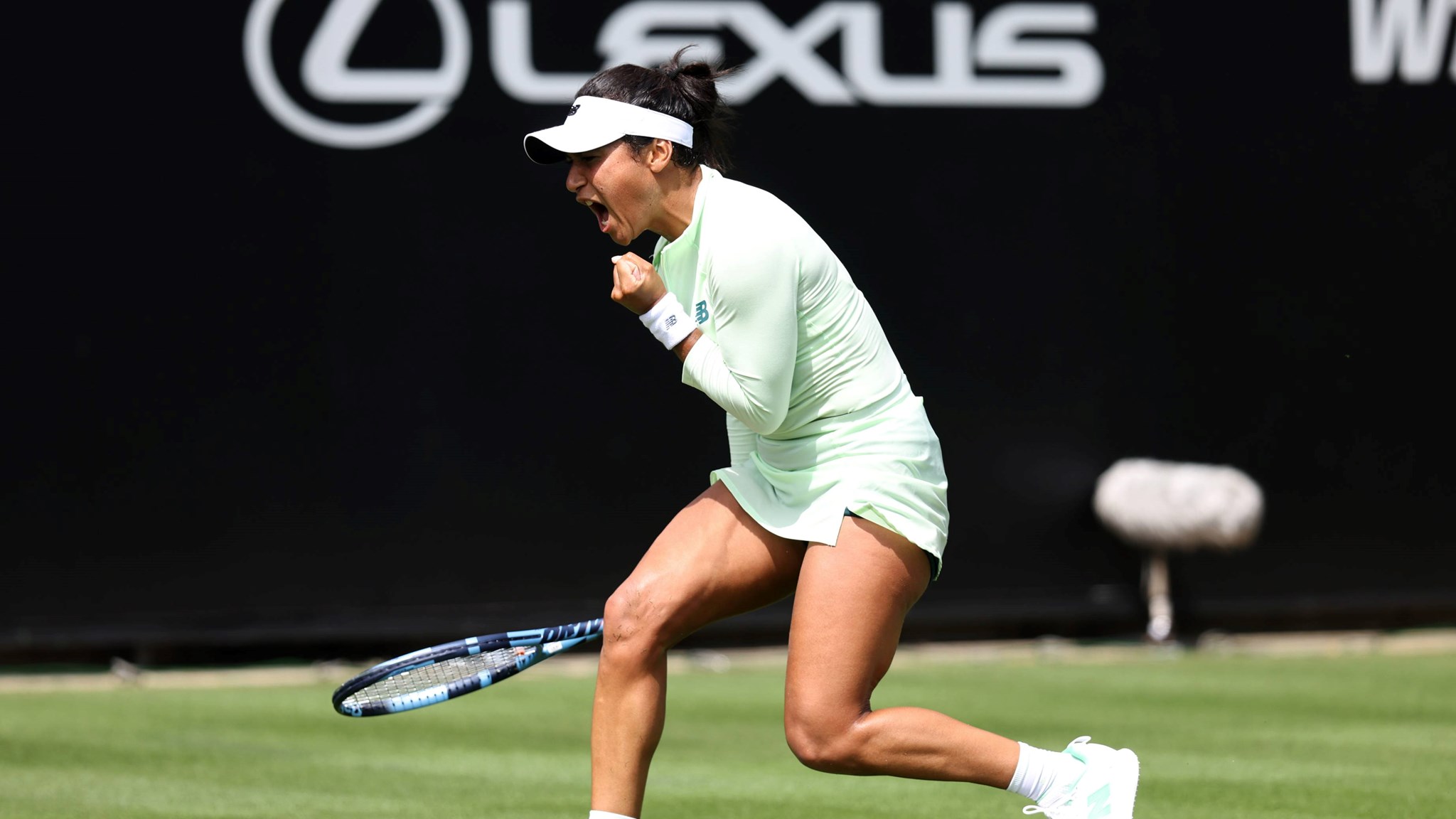 Heather Watson celebrates winning a point at the Lexus Eastbourne Open