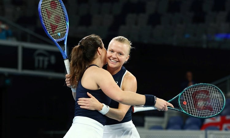Harriet Dart and Jodie Burrage hug in celebration after beating Australia at the Billie Jean King Cup