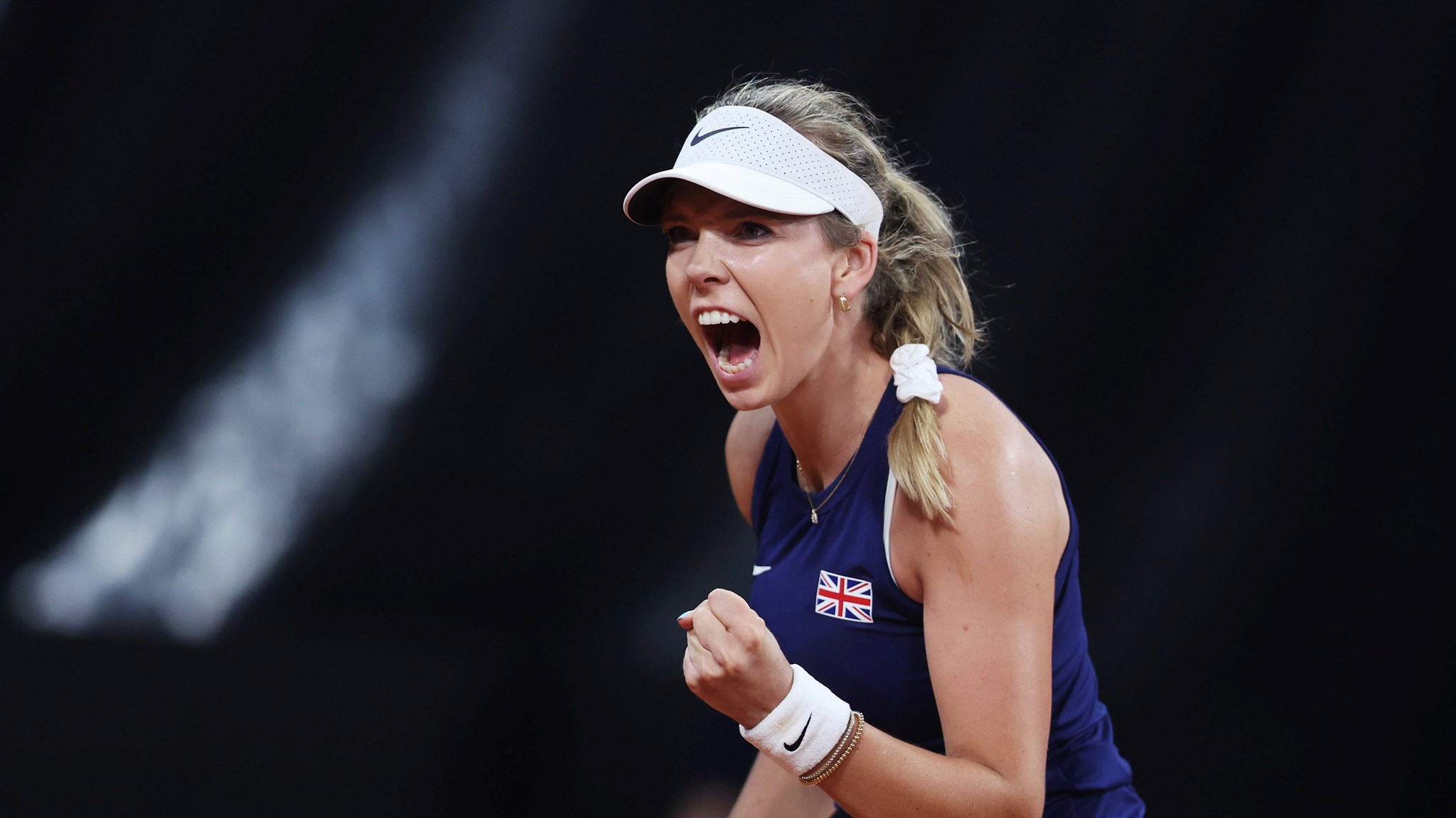 Katie Boulter roaring in celebration on court at the Billie Jean King Cup