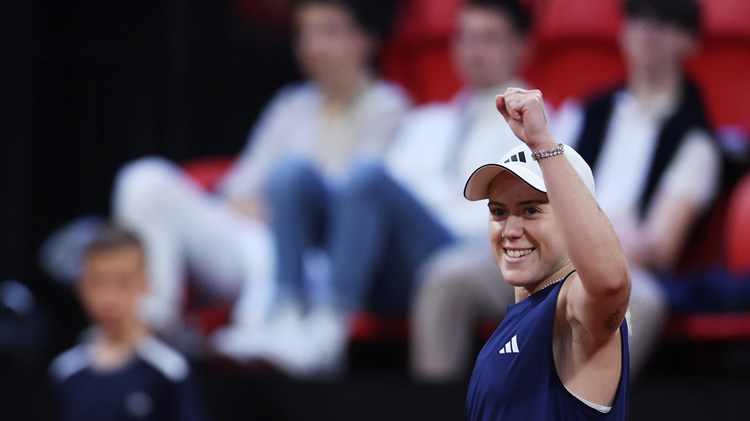 Sonay Kartal raising her arm up in the air and smiling after winning her first match at the Billie Jean King Cup