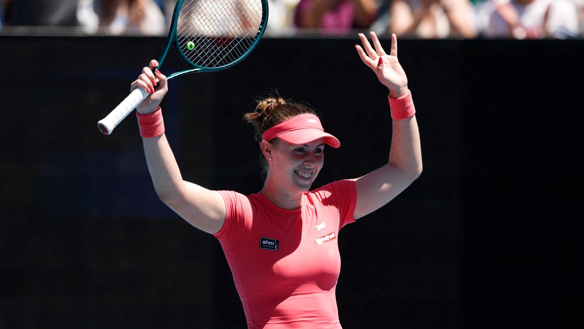 Talia Gibson raises her hands in celebration at the 2026 Australian Open