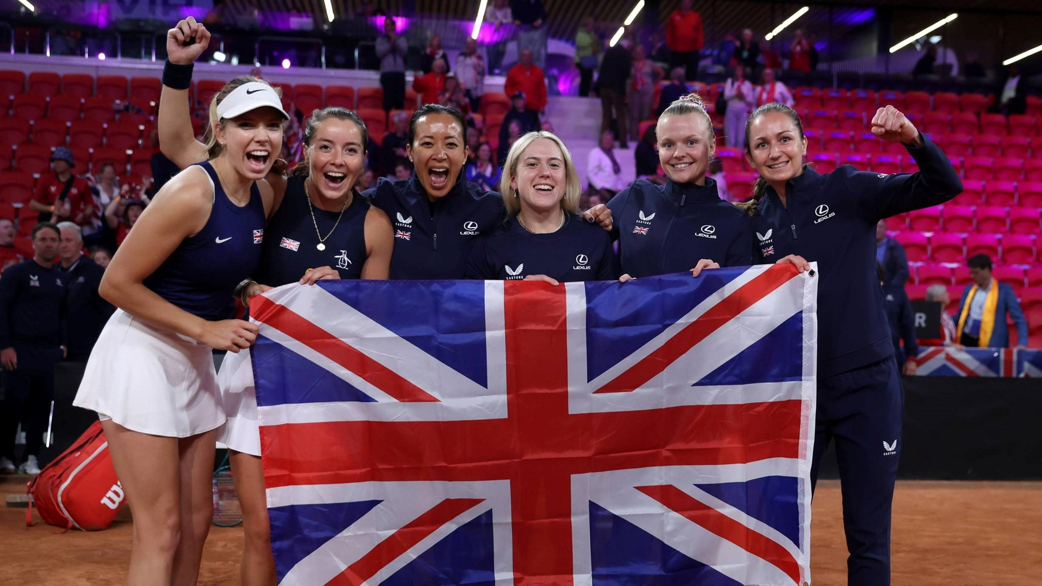 The Lexus GB Billie Jean King Cup team holding the British flag after coming through Qualifiers in The Hague