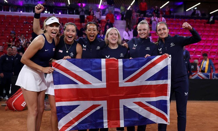 The Lexus GB Billie Jean King Cup team holding the British flag after coming through Qualifiers in The Hague