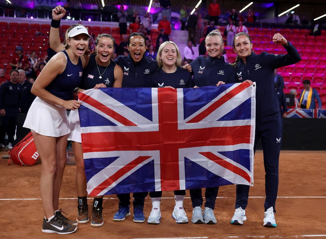 The Lexus GB Billie Jean King Cup team holding the British flag after coming through Qualifiers in The Hague