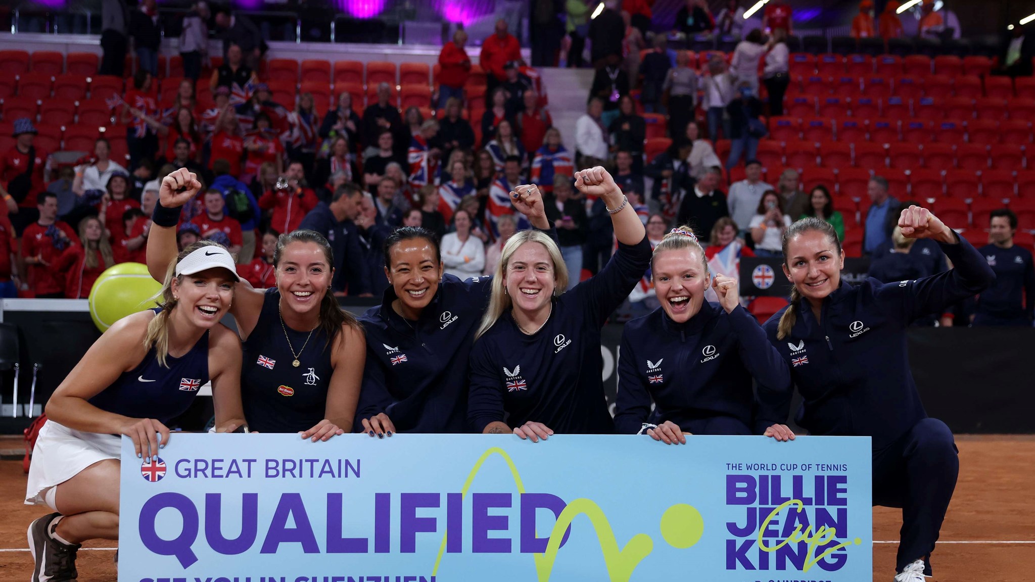 The Lexus GB Billie Jean King Cup team holding the qualified sign after beating Netherlands