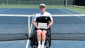 Ben Bartram holding the 2025 men's wheelchair singles title at the Cougar Open 