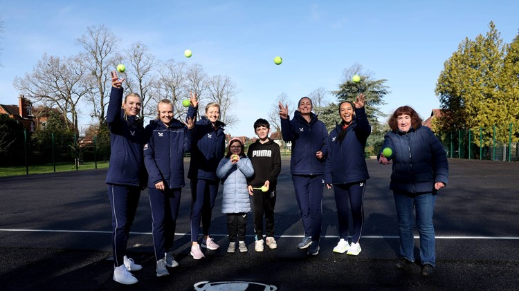 Billie Jean King Cup squad painting a park tennis court at Spencer Park, Coventry