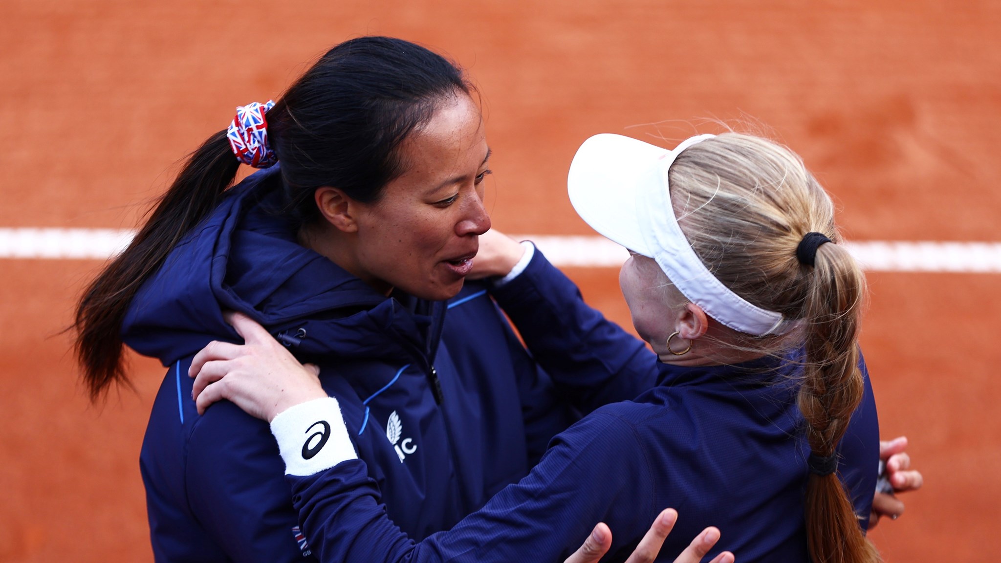 Harriet Dart and Anne Keothavong hug after Dart's win at the 2022 Billie Jean King Cup qualifier