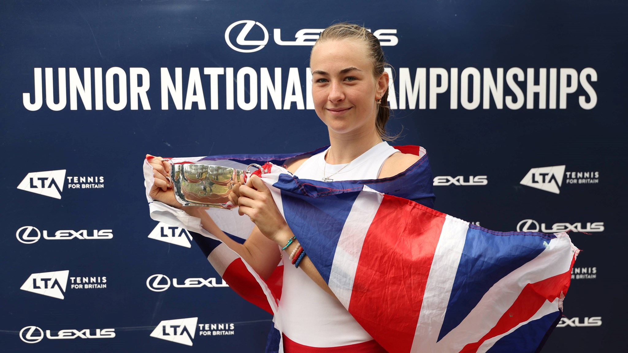 Mika Stojsavljevic holding the 2025 18U Lexus Junior National Championships title