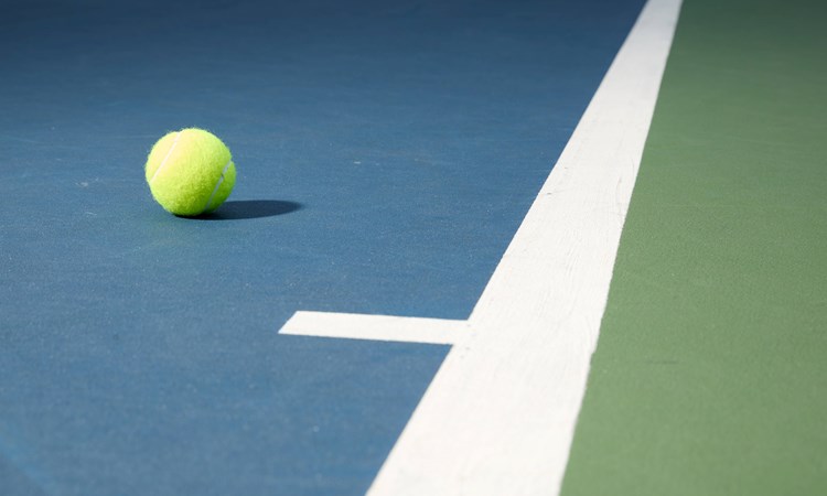 A tennis ball on a court