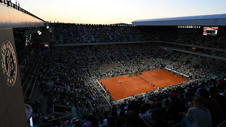 A general view image of a crowd watching two tennis players compete at Roland Garros