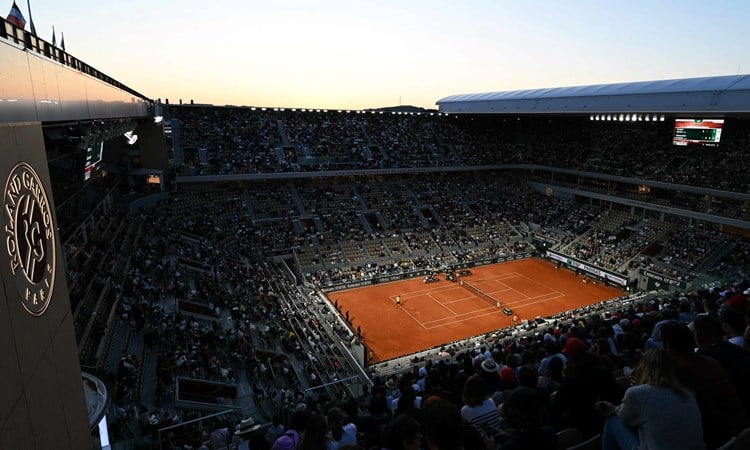 A general view image of a crowd watching two tennis players compete at Roland Garros