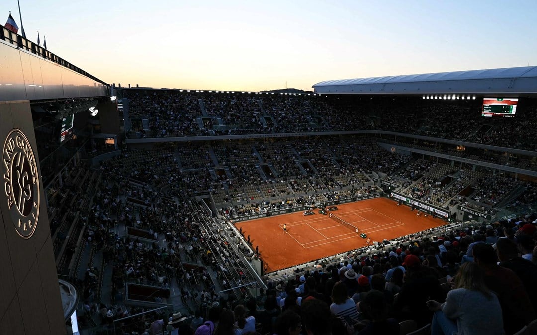 A general view image of a crowd watching two tennis players compete at Roland Garros