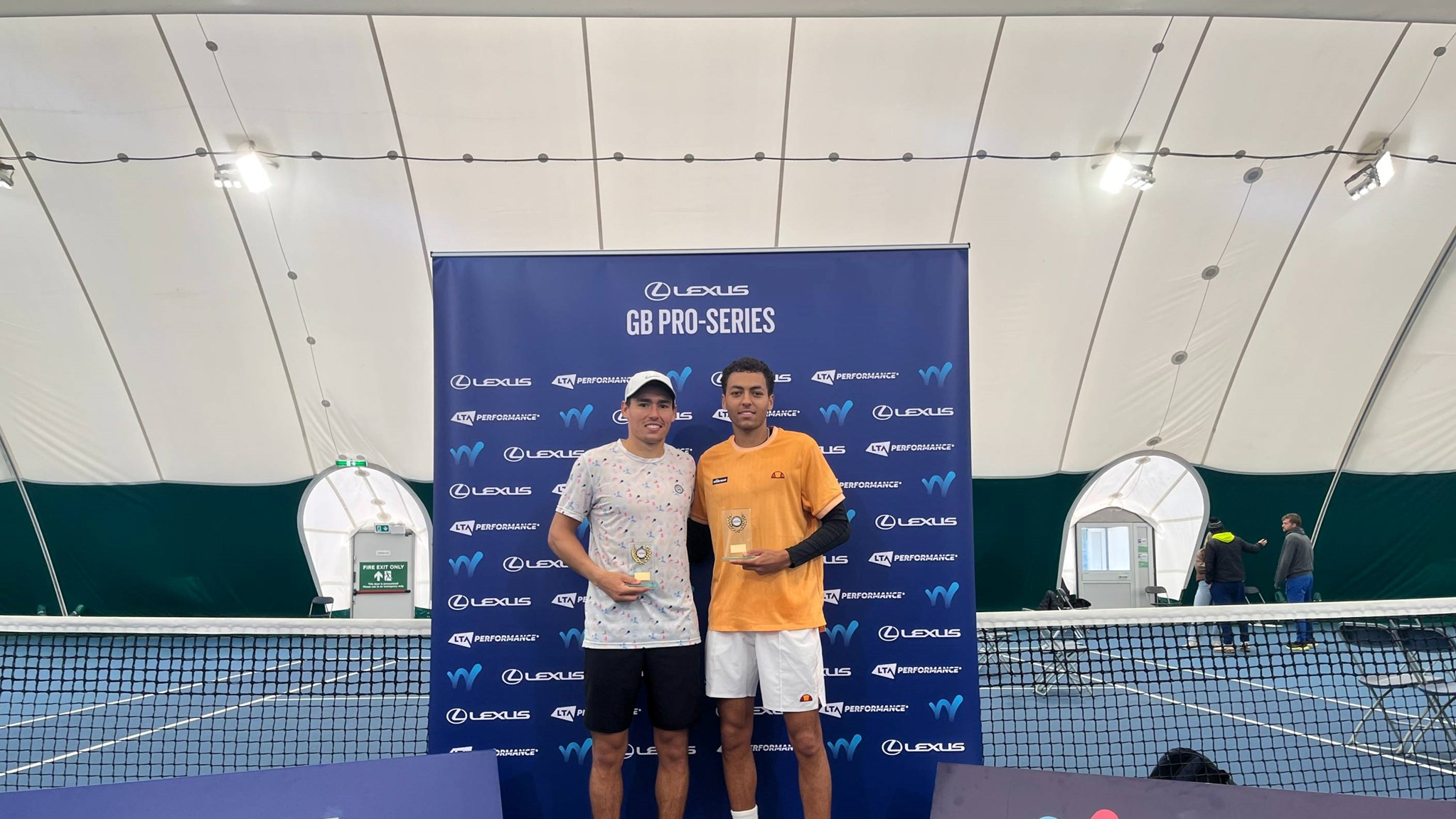 Charles Broom and Paul Jubb holding trophies at the M25 Nottingham