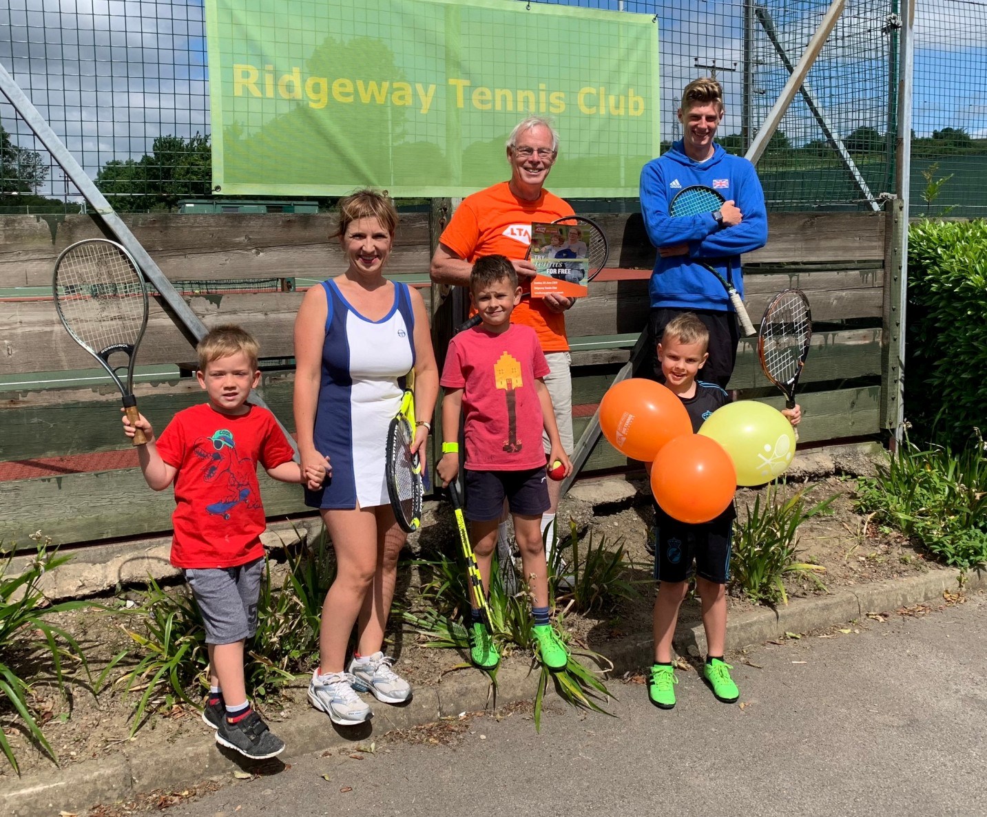 A family celebrating the 100th anniversary of the Ridgeway Tennis Club