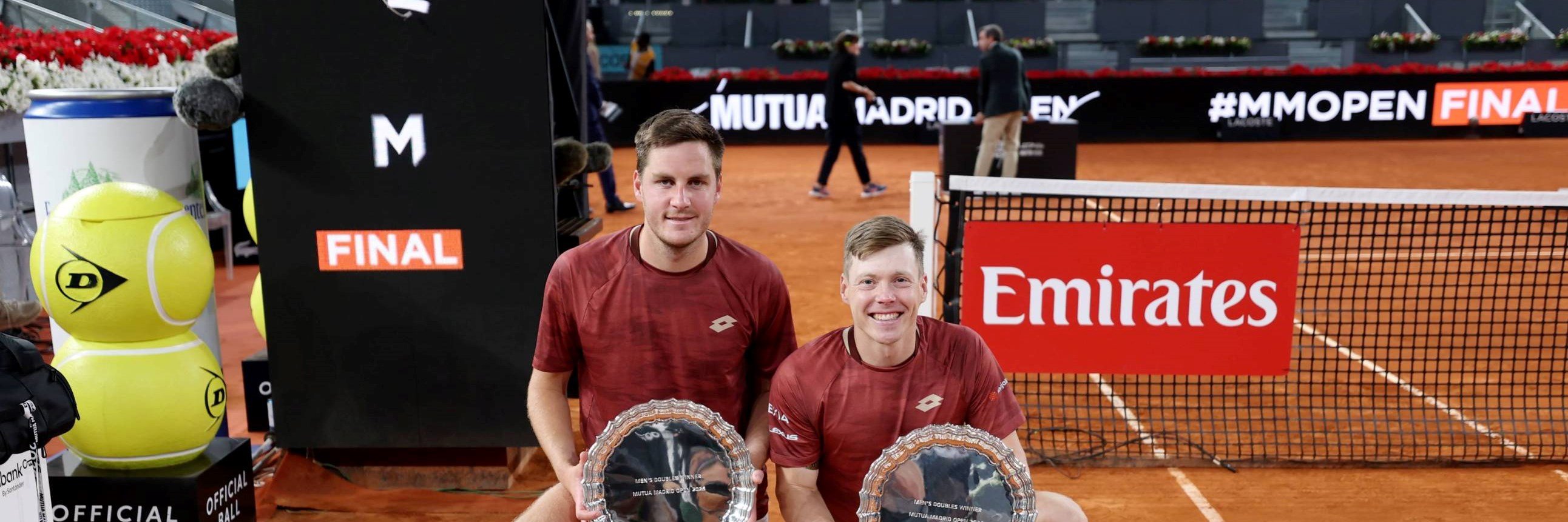 Henry Patten and Harri Heliovaara holding the Mutua Madrid Open title